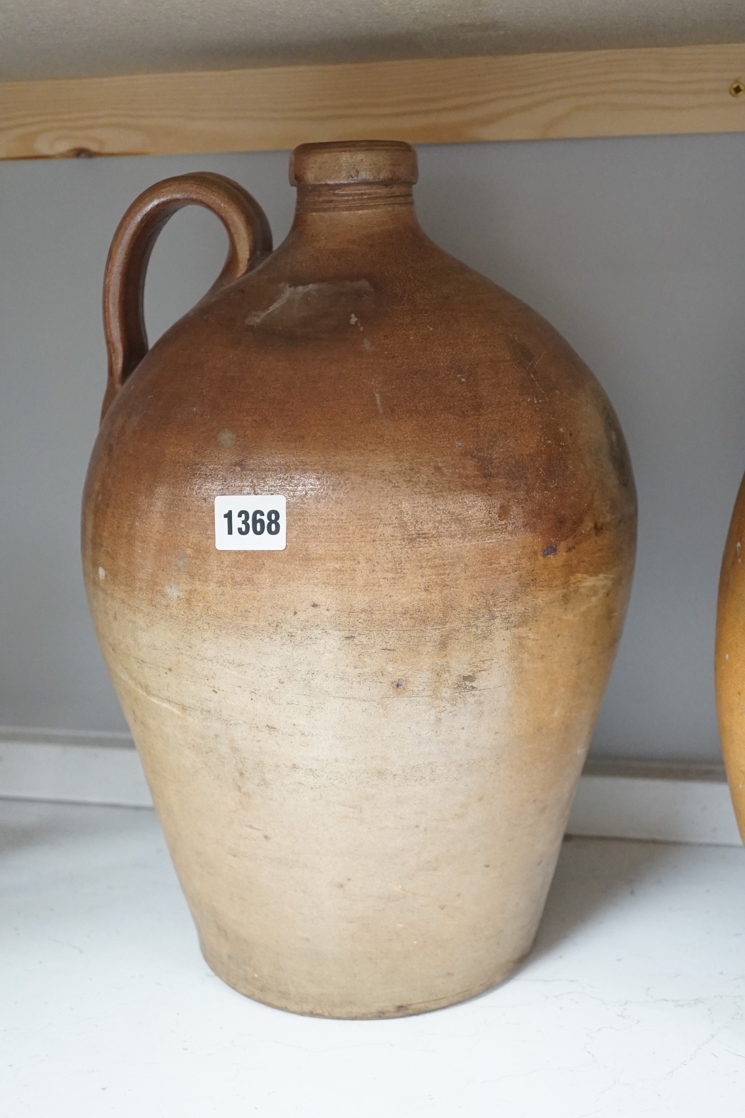 Two 19th century salt glazed stoneware flagons, tallest 44cm